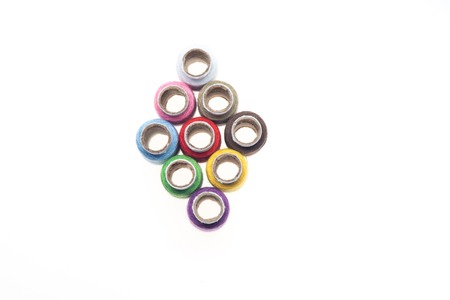 Column of many-colored reels of threads  Top viewの写真素材