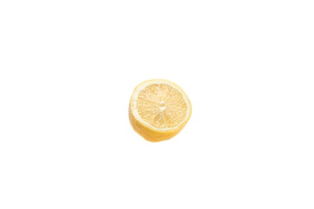 Tempting yellow lemon is a good addition to many dishes  Isolated on the white backgroundの写真素材