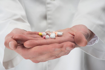 Different pills for keeping your health in the wonder working doctors handsの写真素材