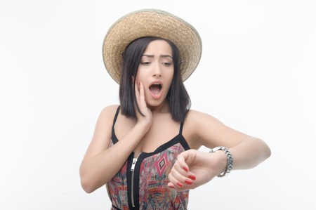 Half-length portrait of lovely dark-haired girl wearing straw hatの写真素材