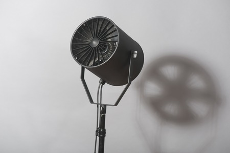 Turned on spotlight standing with the shade  Isolated on white backgroundの写真素材