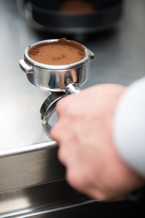 Selected focus on pressed coffee prepared for the coffee machine の写真素材