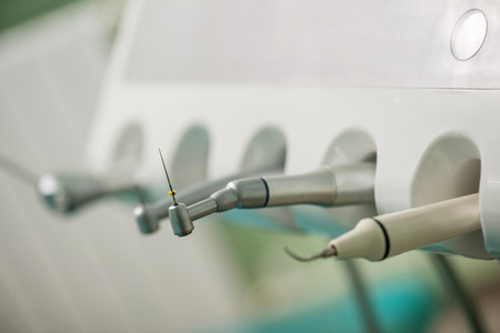 Dentist selecting his items. Dentist equipment. Stomatologys toolsの写真素材