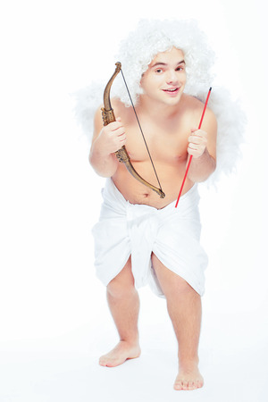 Bringing the love this Valentines. Full length portrait of an adorable little cupid holding a bow...