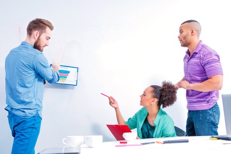 Confident and creative team. Group of cheerful business people in smart casual wear discussing data...