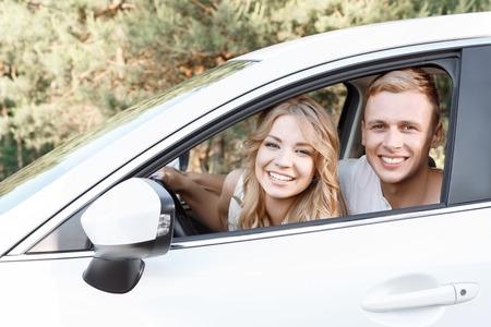 Lovely couple. Portrait of a young beautiful blond woman with curvy hair and her handsome boyfriend...