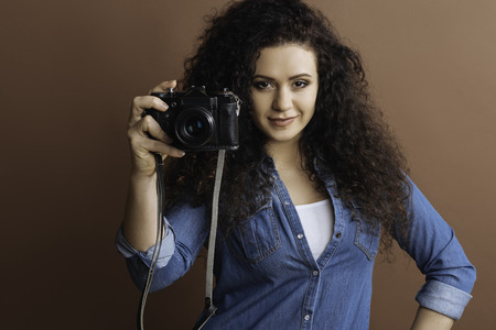 Self-confident lady being in the mood for shooting