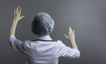 Female doctor turning her face to the wall