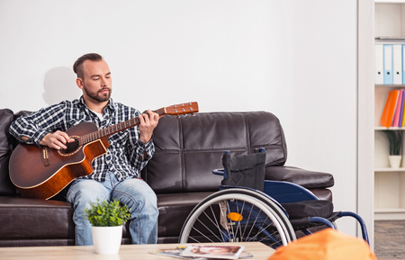 Relaxed musician working on new songの写真素材