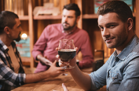 Handsome attractive man having alcoholic drinkの写真素材