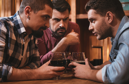 Handsome attractive men exchanging their secretsの写真素材