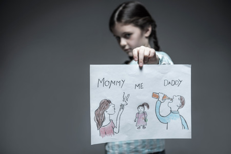 Luckless young girl standing in semi positionの写真素材