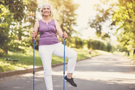 Cheerful senior woman doing a physical exerciseの写真素材