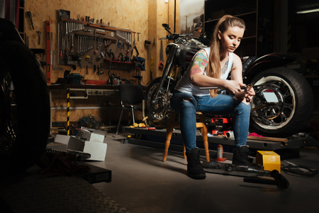 Very attentive girl measuring detailsの写真素材