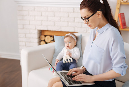 Prominent young businesswoman writing a business letterの写真素材