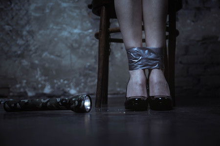 Petite woman being a victim of kidnappingの写真素材