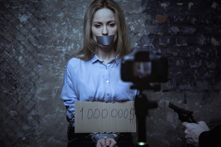 Wicked abductor making a video for ransomの写真素材