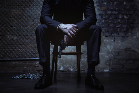 Powerful criminal posing with a pistolの写真素材