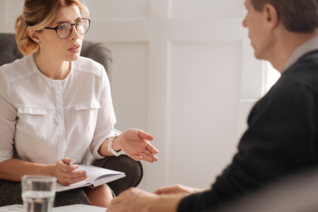 Professional confident therapist working with her patientの写真素材