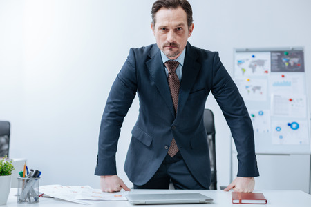 Angry businessman showing his discontent in the officeの写真素材