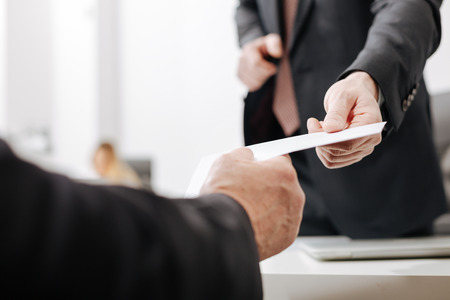 Surprised employee receiving the dismiss notification from the bossの写真素材