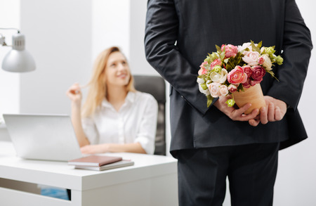 Attentive coworker having surprise for the colleagueの写真素材