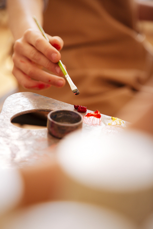 Gifted child having art lesson at schoolの写真素材