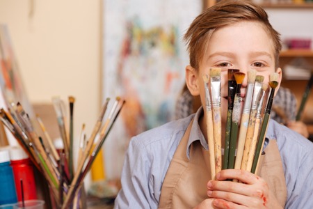 Joyful little boy having fun at schoolの写真素材