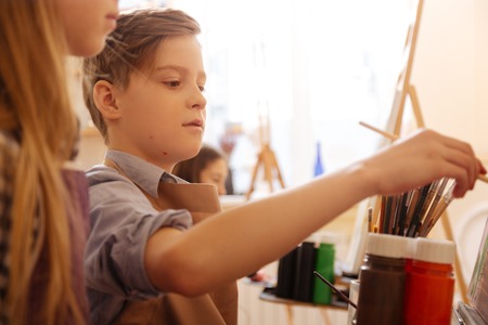 Involved kids practicing painting in the art studioの写真素材
