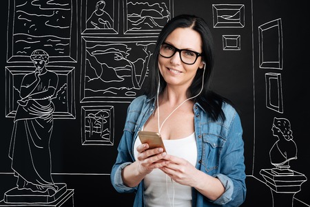 Intelligent attractive woman visiting a museumの写真素材