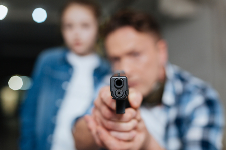 Gun barrel being pointed at you