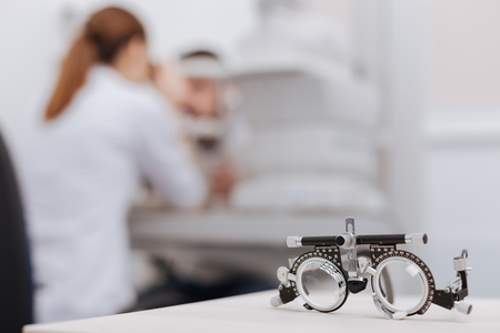 Selective focus of eye test spectacles lying on the table