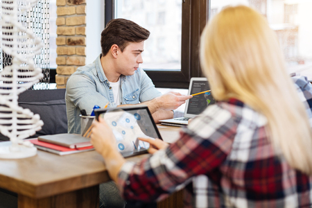 Involved smart students studying togetherの写真素材
