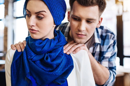 Attractive muslim woman experiencing humiliation from a manの写真素材