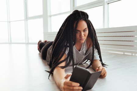 Artistic dreamy woman resting after rehearsalの写真素材