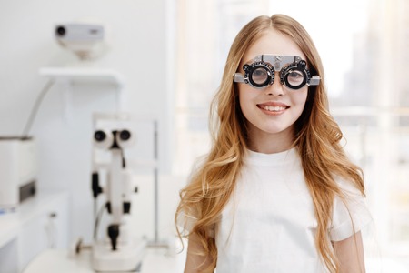Beautiful teenage girl wearing trial glasses