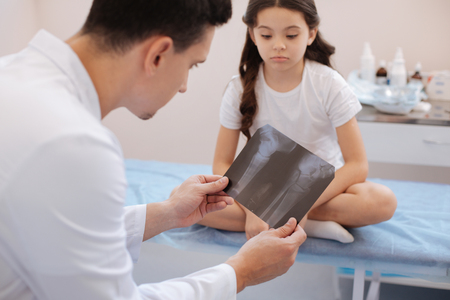 Professional experienced doctor putting a diagnosisの写真素材