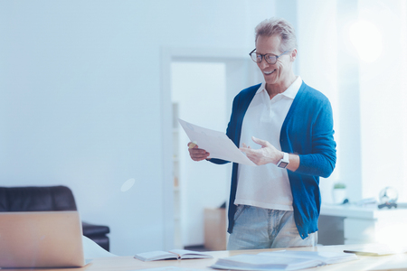 Cheerful office worker working the projectの写真素材