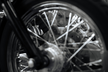 Excellent master mechanic repairing a wheel
