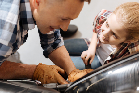 Engaged girl looking at her dad fascinationの写真素材