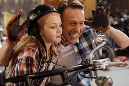 Active funny couple goofing around in garageの写真素材