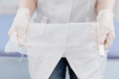 Professional experienced doctor holding the bandageの写真素材