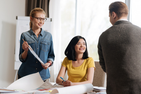 Positive friendly designers discussing a new projectの写真素材