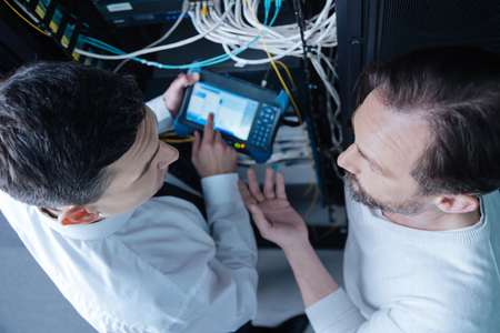 Top view of professional technicians having a conversationの写真素材