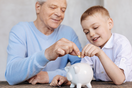 Wise experienced man explaining things about economyの写真素材