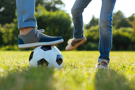 Sincere ambitious child playing with his dadの写真素材