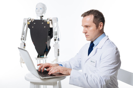 Passionate competent man carrying out scientific researchの写真素材