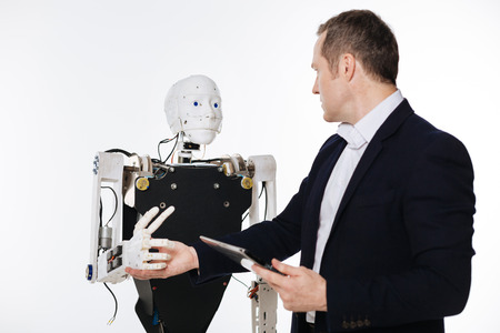 Dynamic enthusiastic scientist testing machine reflexesの写真素材