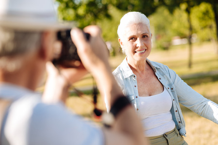 Beautiful mature woman looking at photographerの写真素材