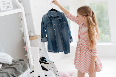 Girl choosing clothes for daily lookの写真素材